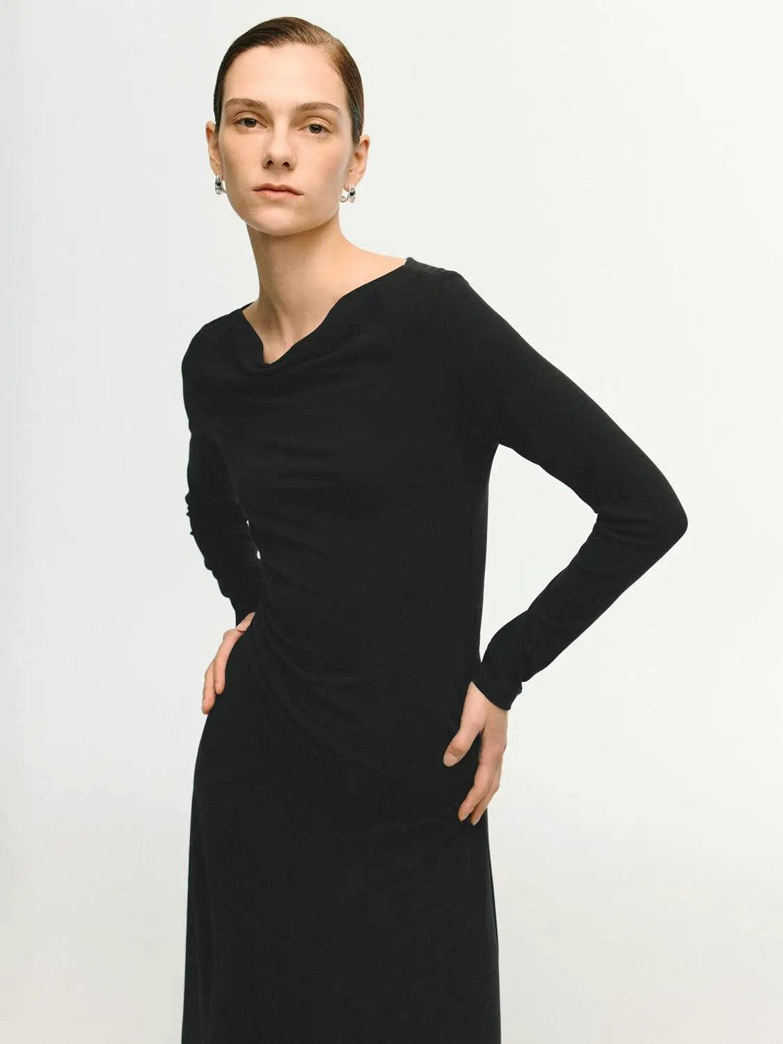 Cowl neck ruched long-sleeve black midi dress worn by model