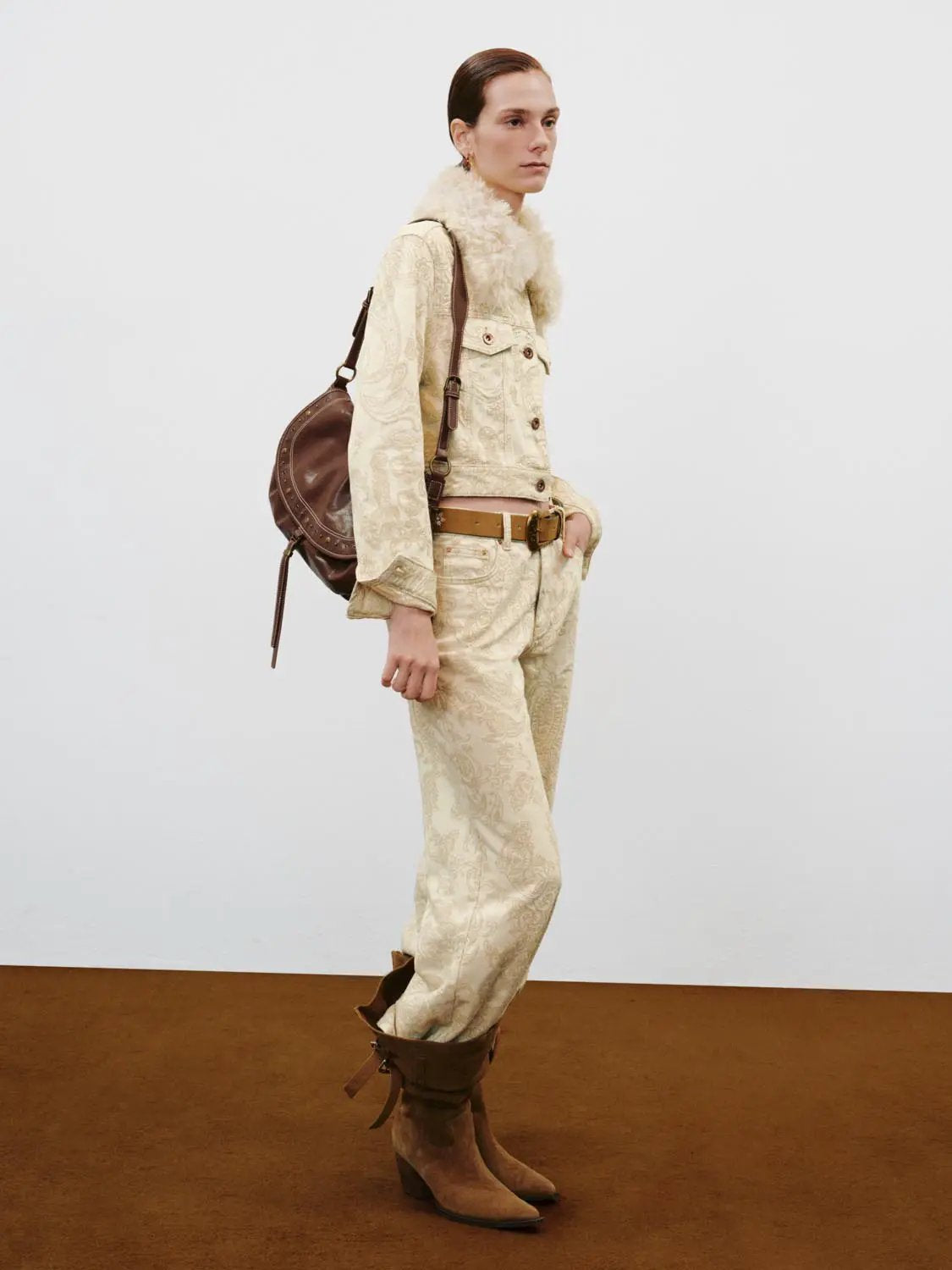 Casual pants in beige paisley-print fabric with brown belt and boots