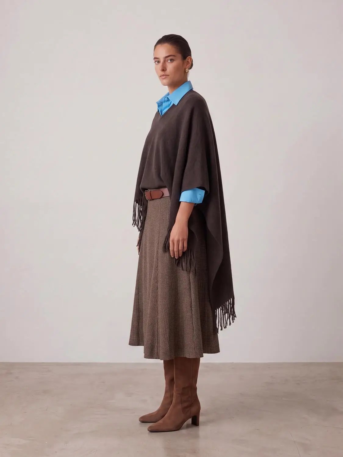 Tassels Hem Oversize Knitted Cardigans, brown with fringe hem, styled over a blue shirt.