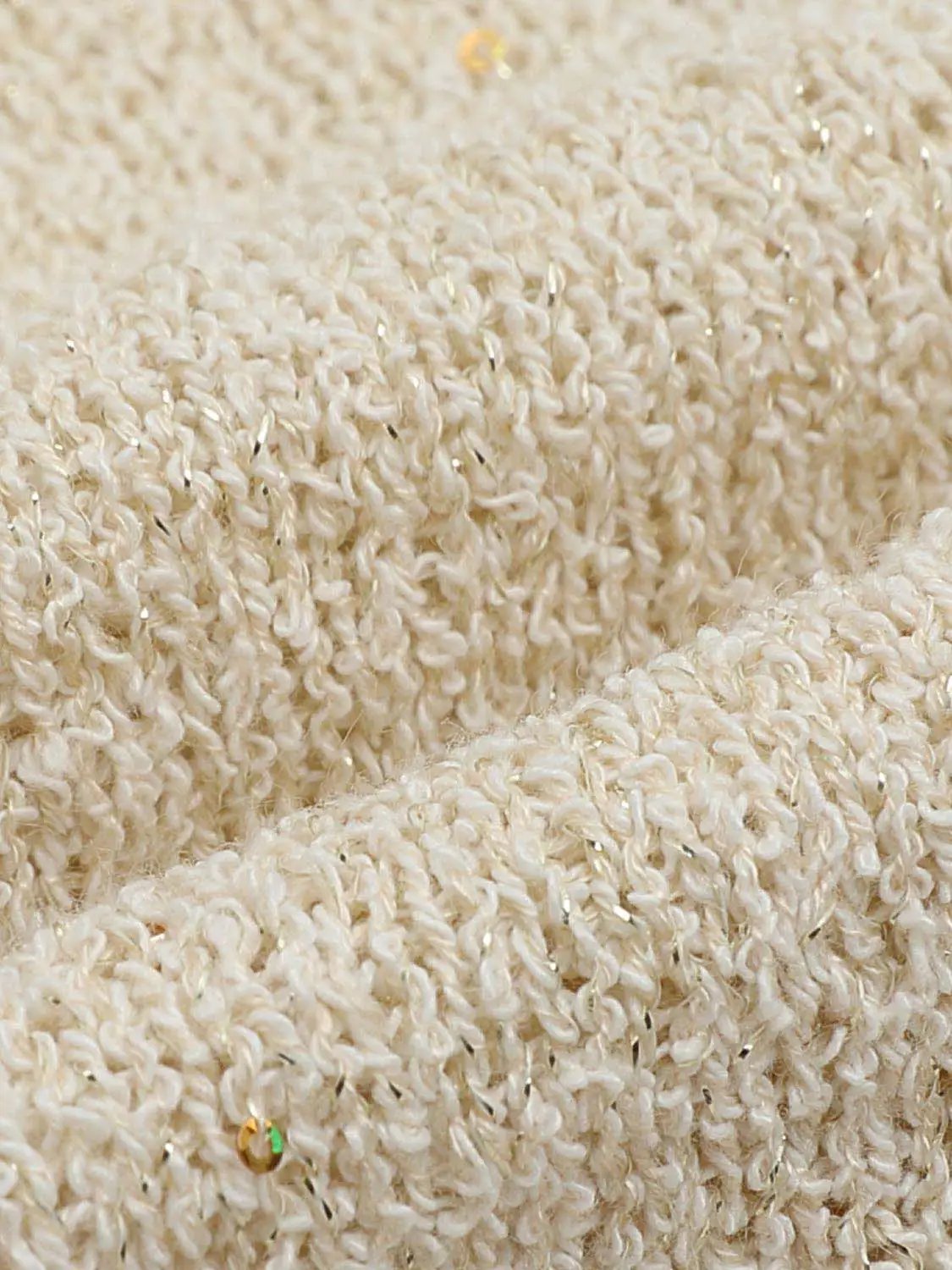 Oversized cropped textured boat-neck sweater in beige boucle knit with subtle metallic specks