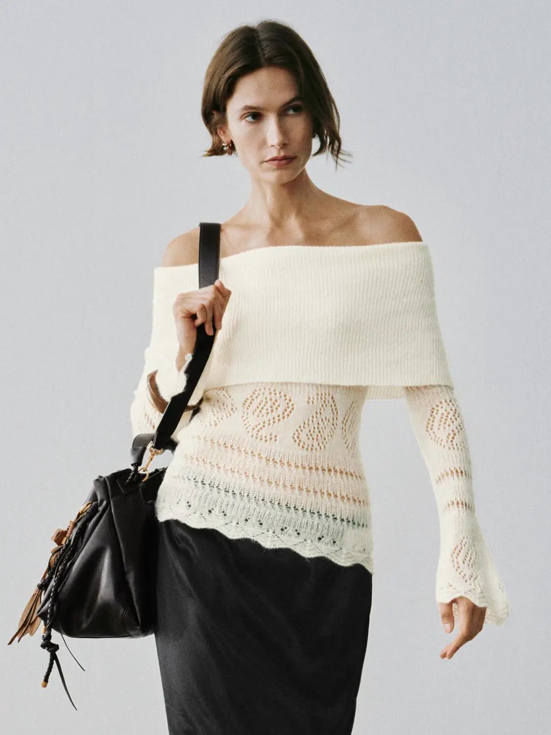 Off-shoulder rib-knit lace long-sleeve T-shirt in ivory.