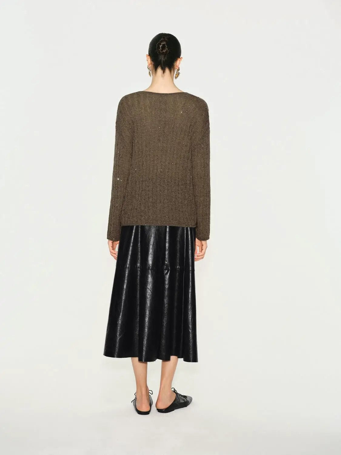 Textured long-sleeve knit T-shirt in brown with a black shiny midi skirt; two-piece ensemble by Urban Revivo Fashion.