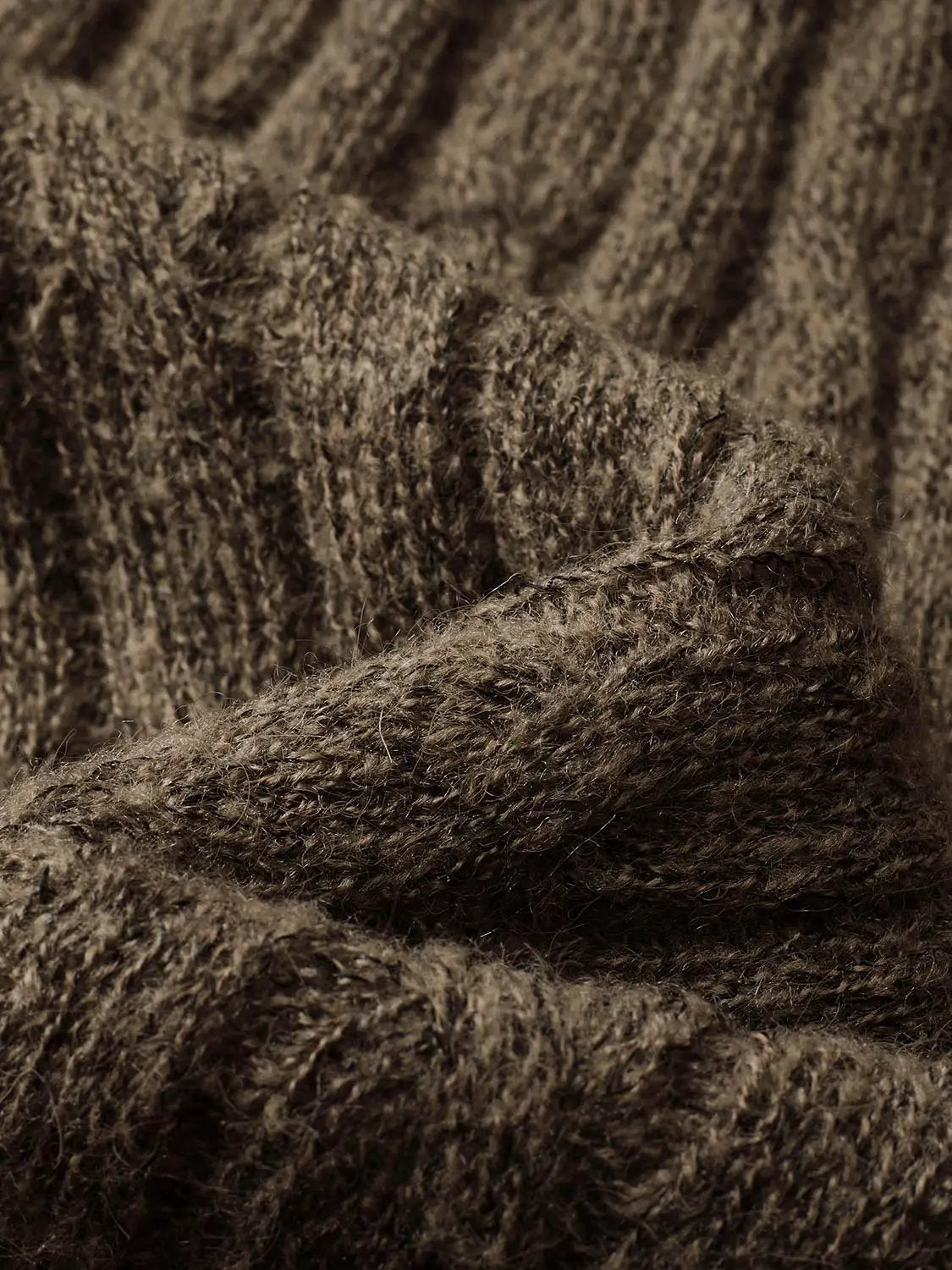 Textured long-sleeve knit T-shirt fabric close-up in dark brown