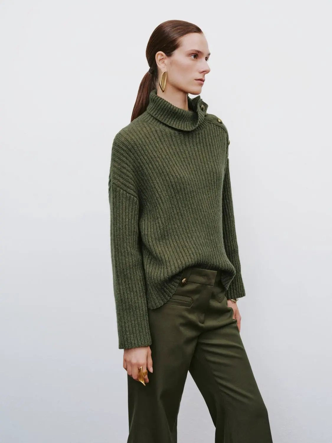 Ribbed asymmetric button long sleeve sweater in olive green knit with shoulder button detail