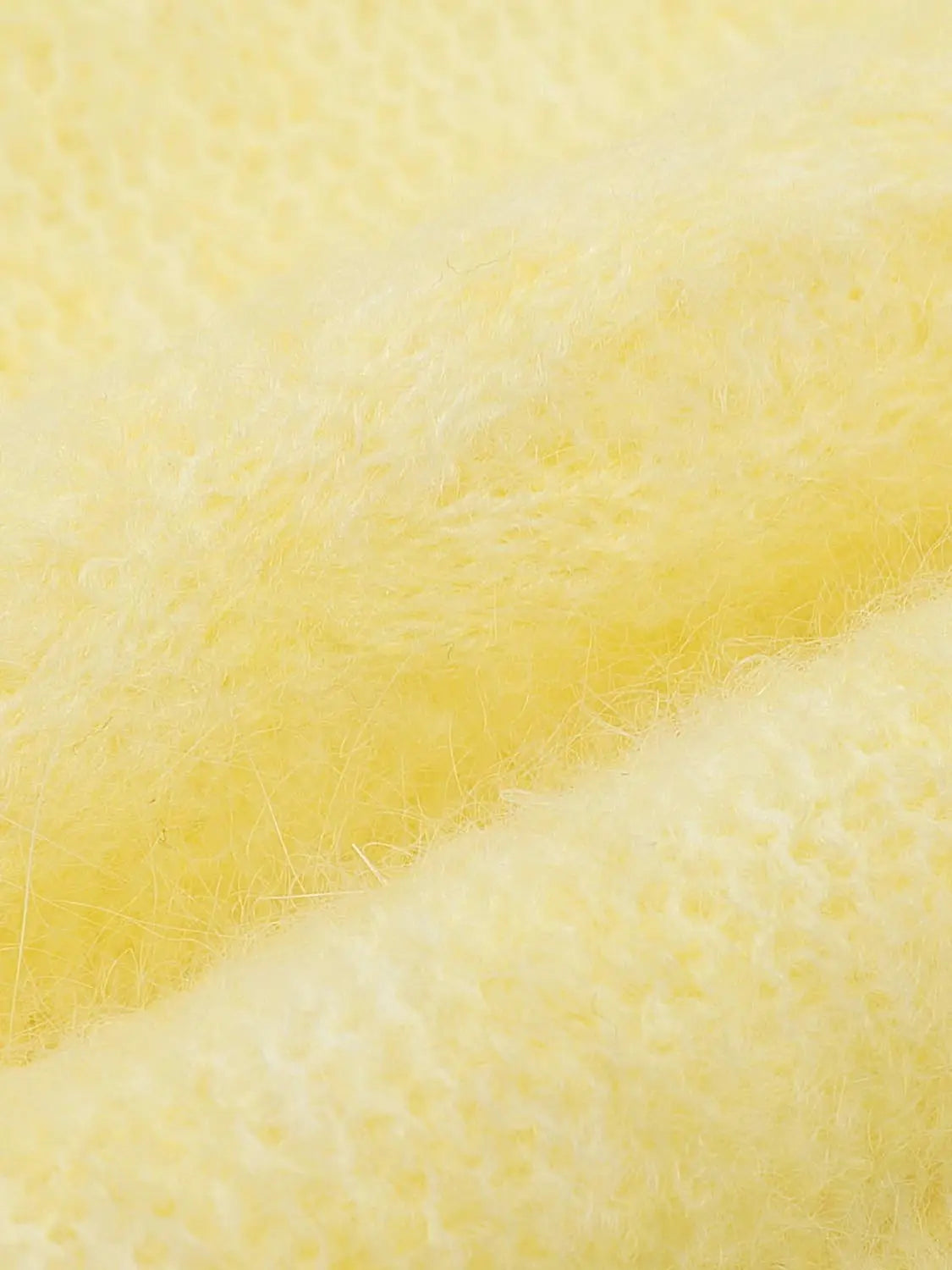 Knit T-Shirt in yellow; close-up of soft fuzzy knitted fabric.