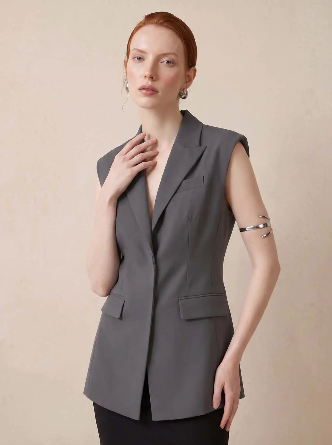 Sleeveless lapel-collar button-front vest in gray by Urban Revivo Fashion