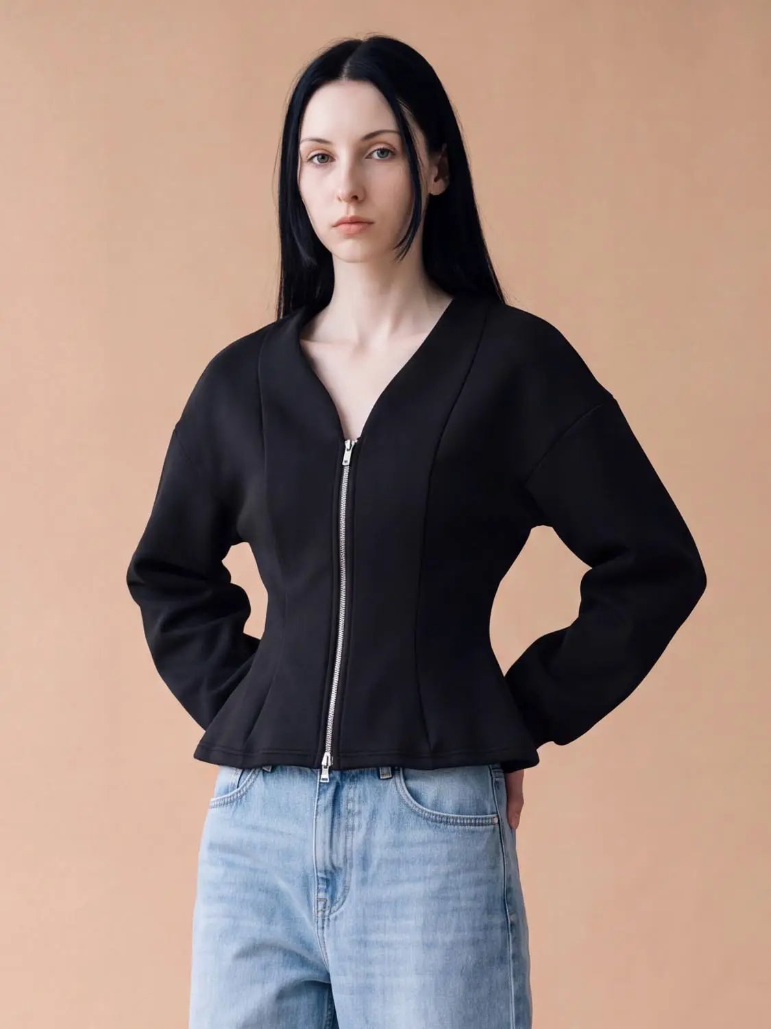 Women's black V-neck zip-front cropped jacket with a fitted waist and silver zipper