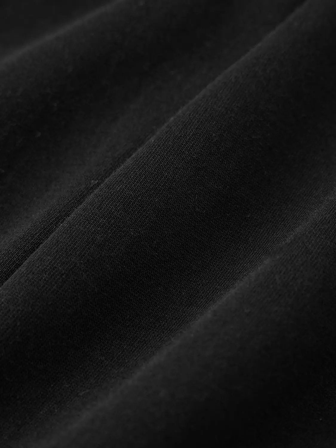 V-neck zip-front fitted waist cropped jacket by Urban Revivo in black fabric close-up