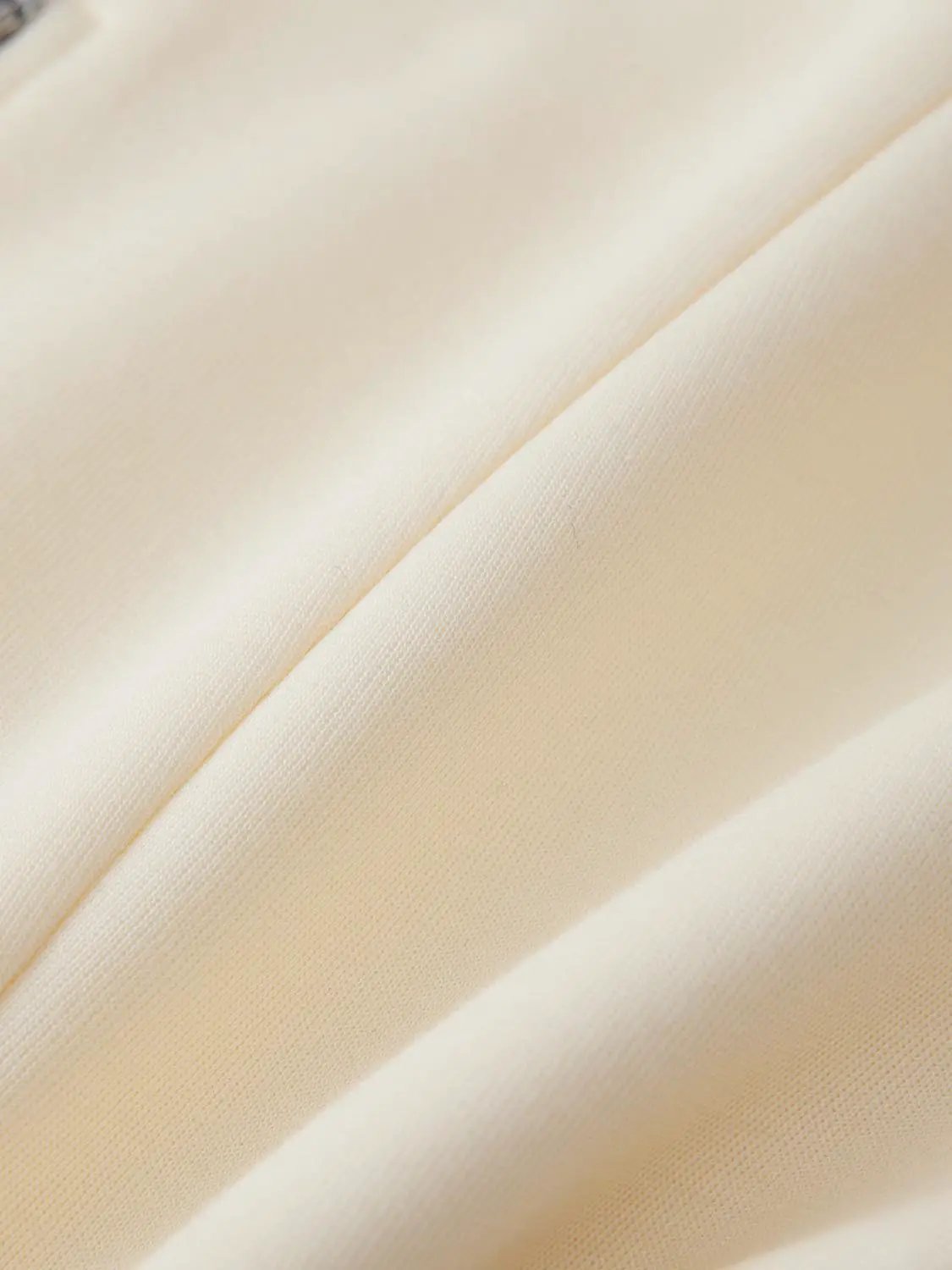V Neck Zip Front Fitted Waist Cropped Jacket in cream satin fabric close-up