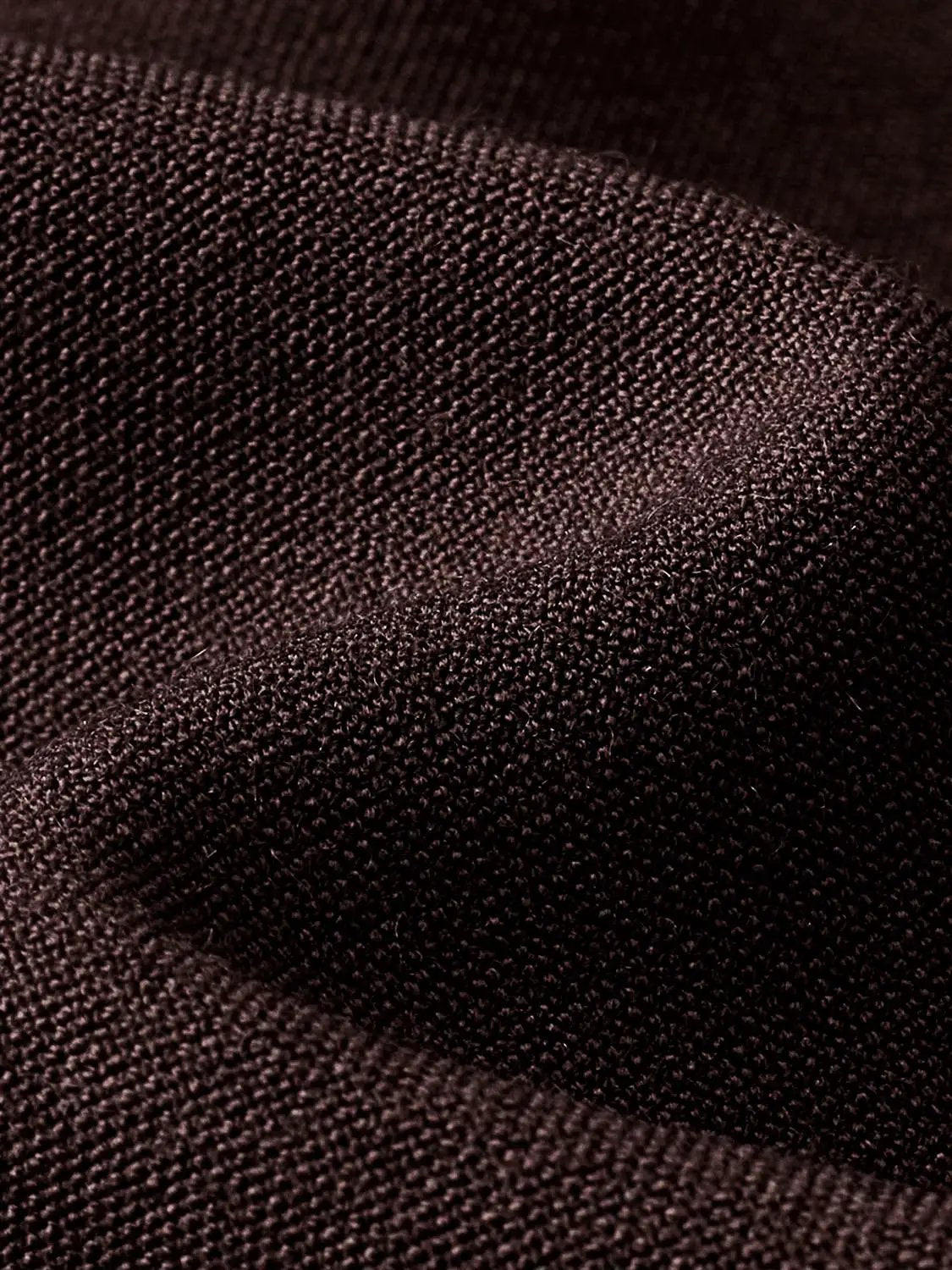 Button-front shirt in burgundy textured fabric close-up