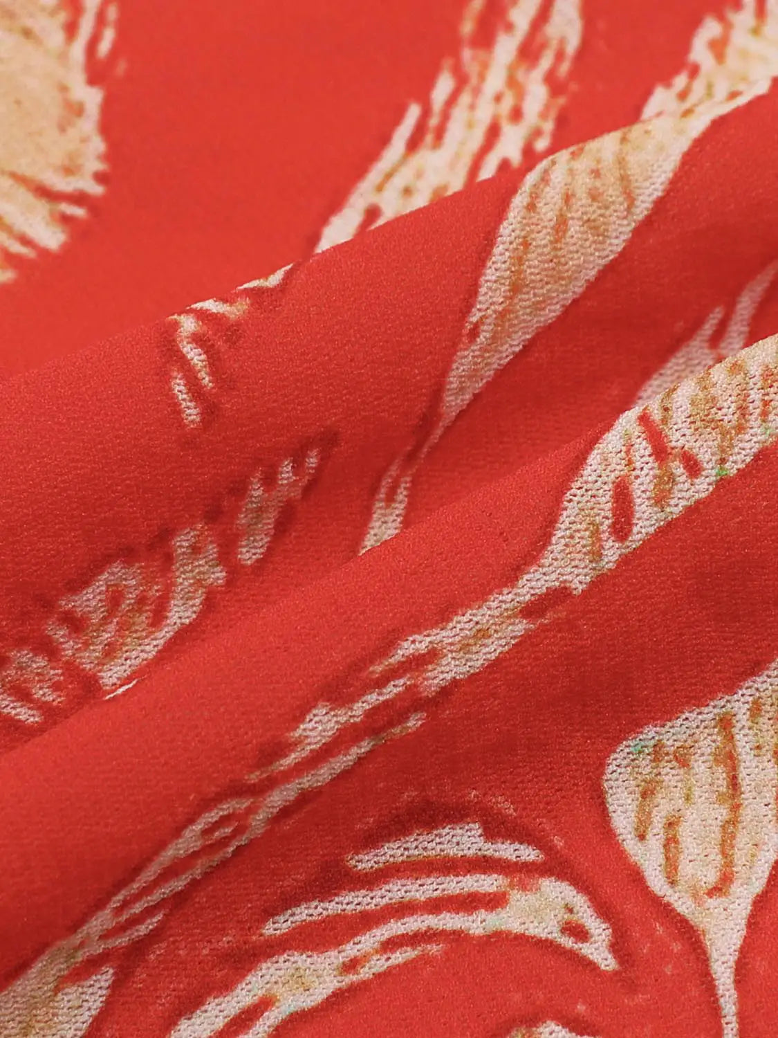 Bandeau top in bold red fabric with cream abstract print; close-up texture highlights pattern and subtle sheen.