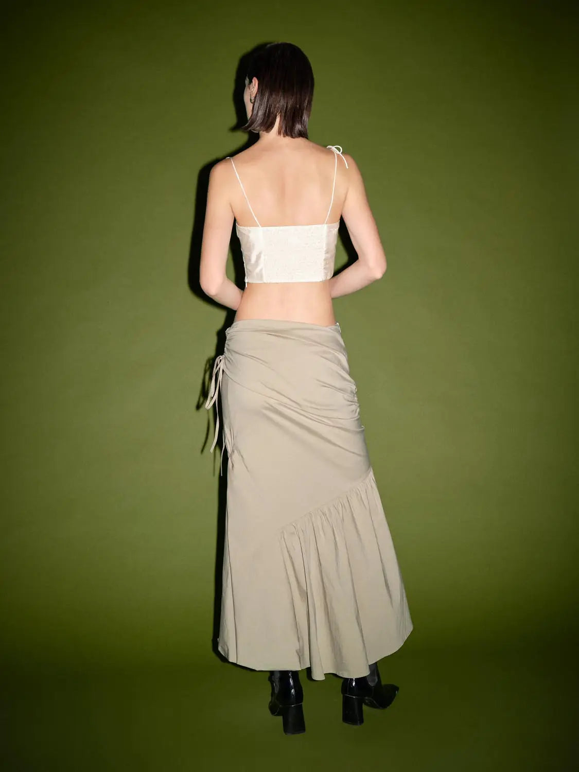 Ruched split-hem fishtail cotton midi skirt in beige with side ruching and drawstring tie.