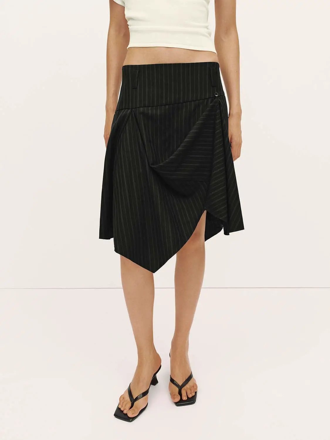 Pinstripe high-waist draped wrap midi skirt by Urban Revivo Fashion, black with subtle stripes, asymmetric hem