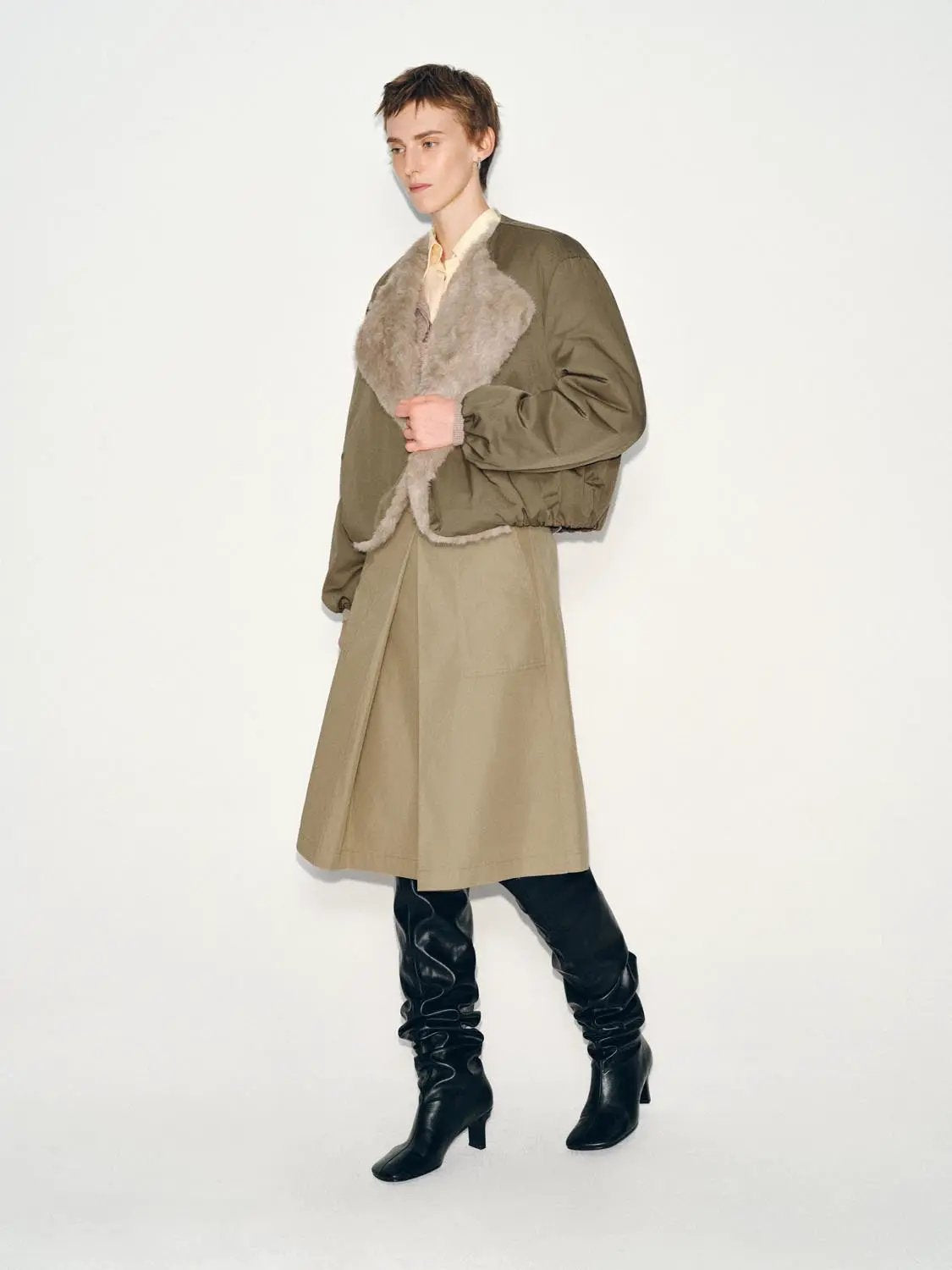 Pleated mid-rise belted A-line midi skirt in beige khaki by Urban Revivo