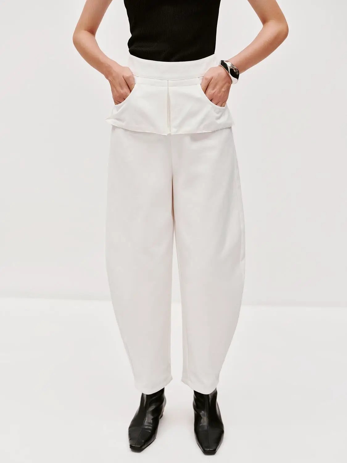 Layered Overlay Draped Waist Wide-Leg Cotton Trousers, curved-leg style in white.