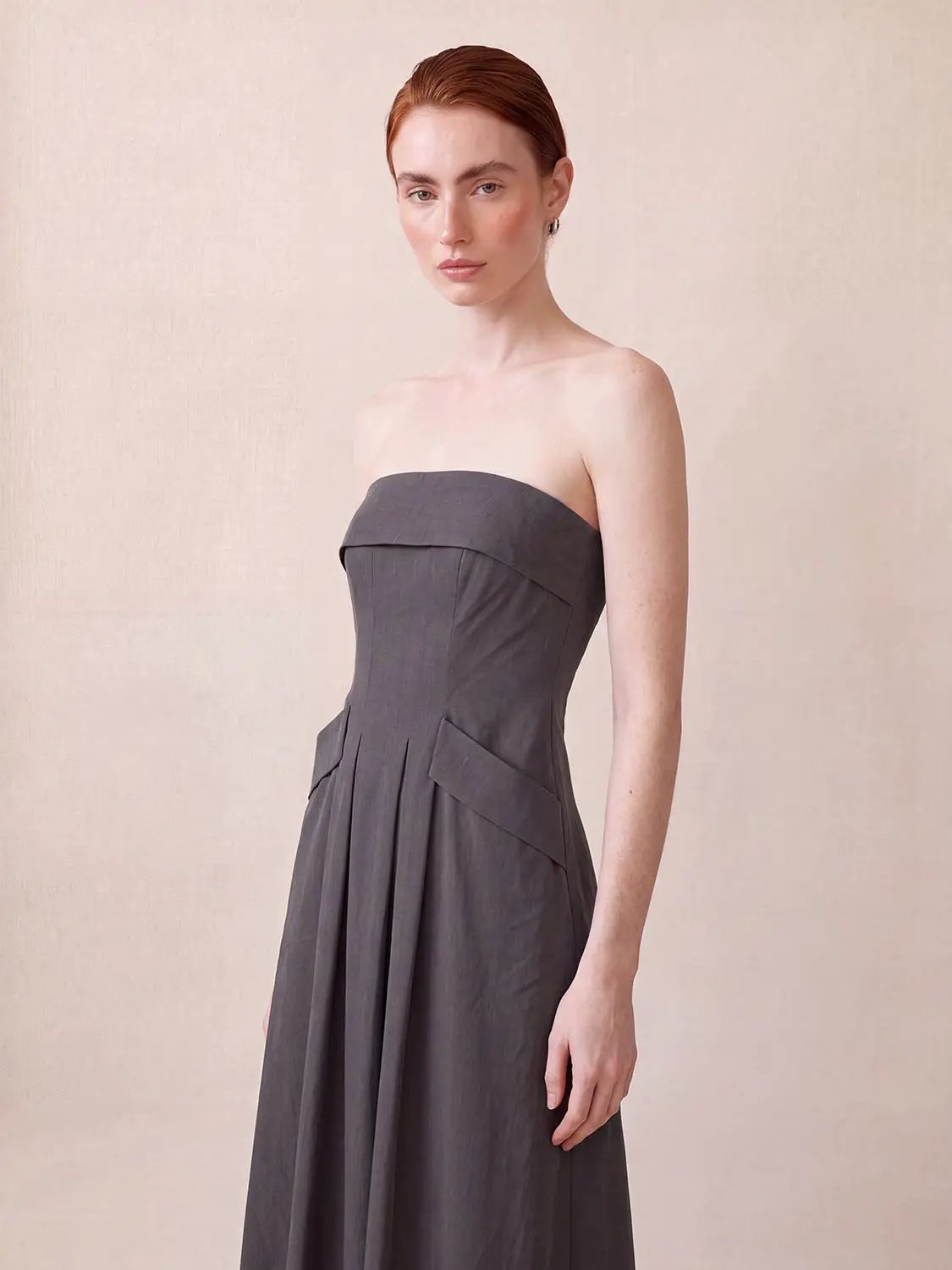 Strapless bandeau pleated stretch A-line maxi dress in charcoal gray