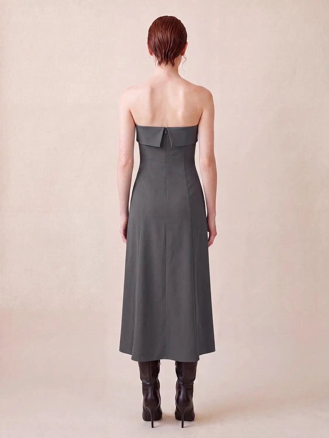 Strapless bandeau pleated stretch A-line maxi dress in charcoal gray with back zipper.