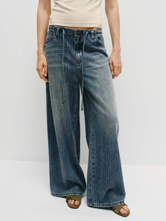 Pantaloni in denim a gamba larga con coulisse e motivo gessato