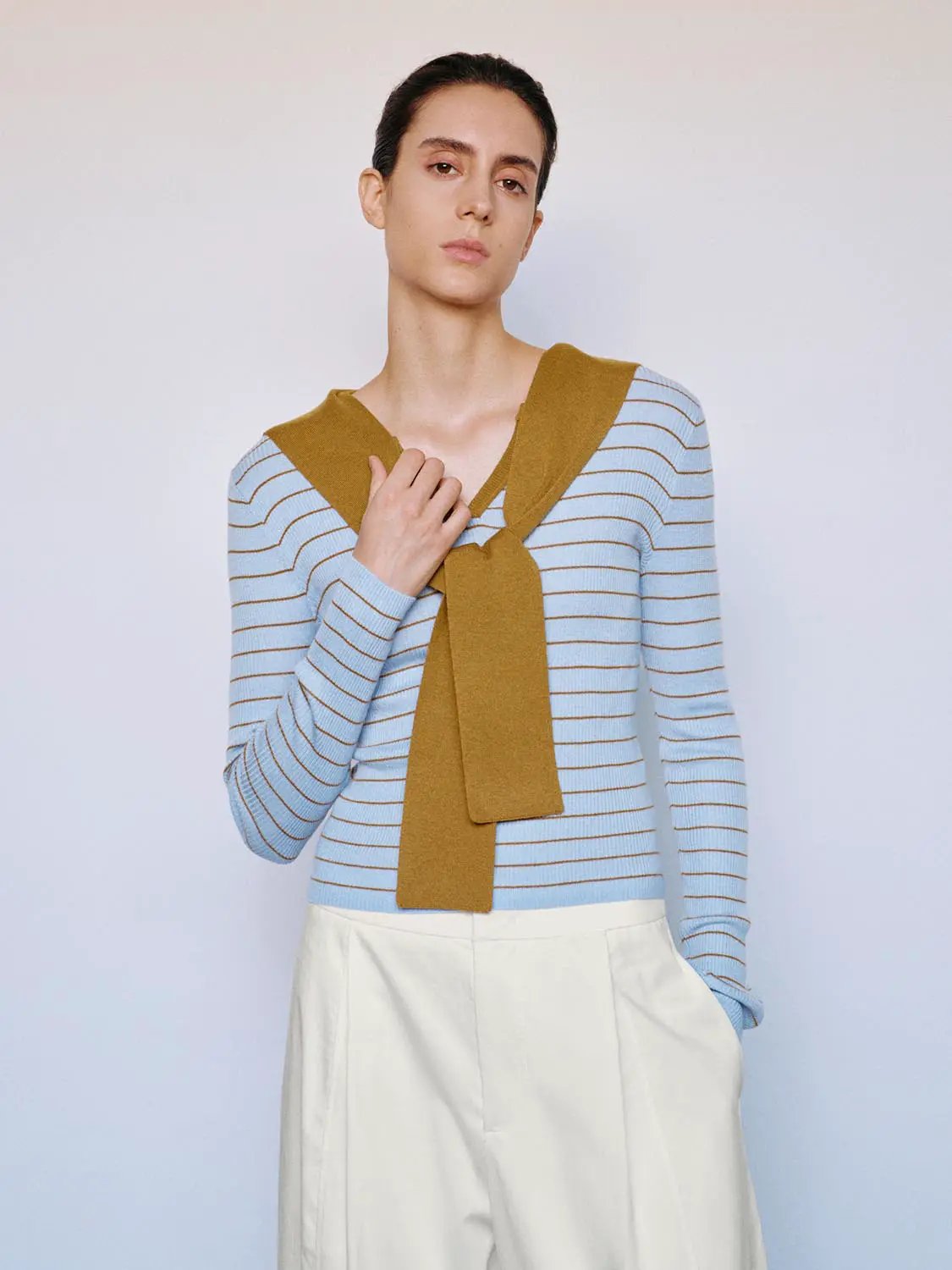 Striped knit T-shirt in light blue with mustard shawl, fitted long sleeves.