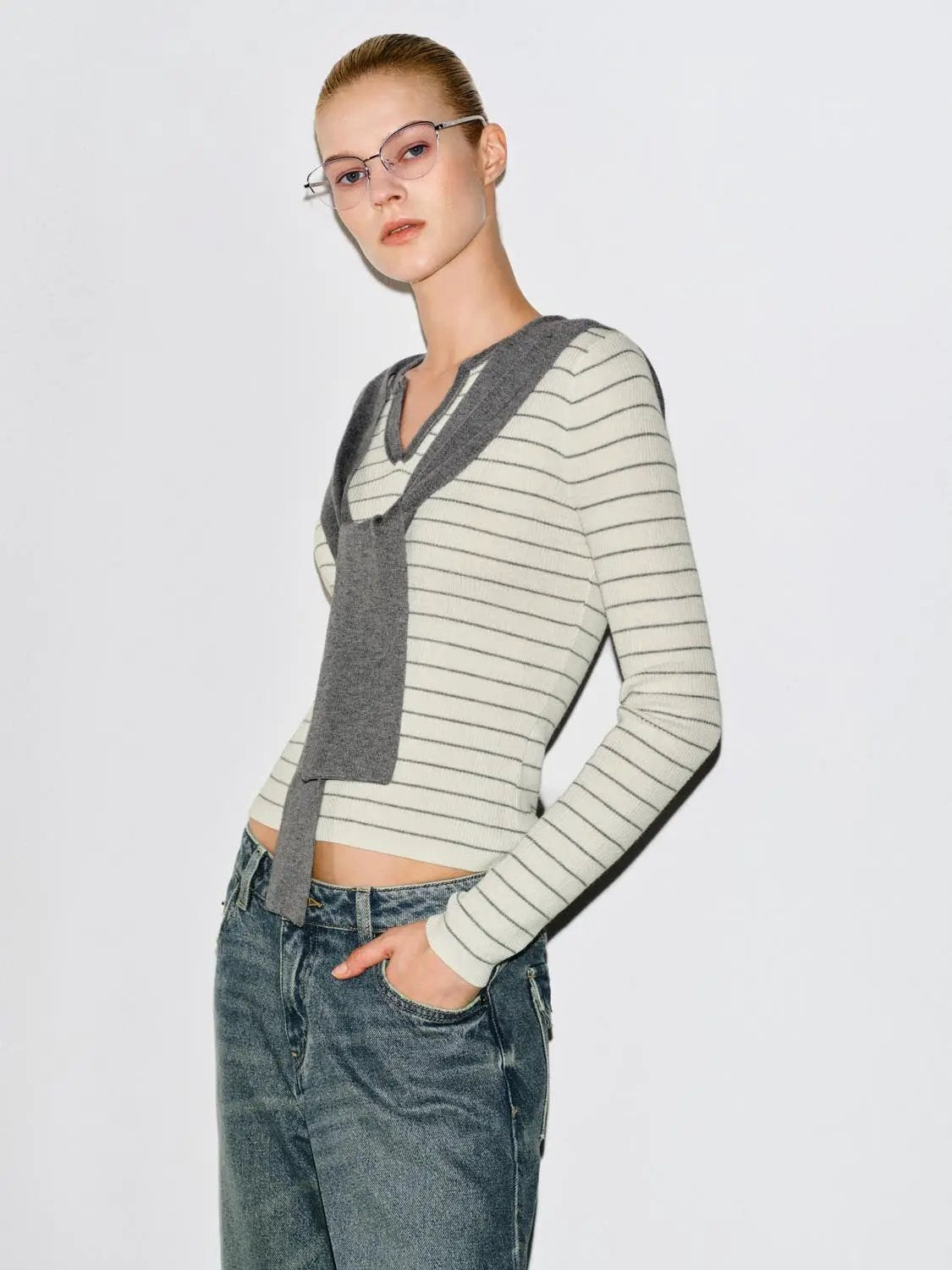 Striped knit T-shirt with V-neck and gray shawl overlay; long sleeves, fitted silhouette