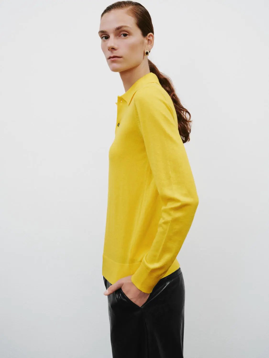 Polo Collar Long Sleeve Fitted Knit Sweater in yellow worn by a model