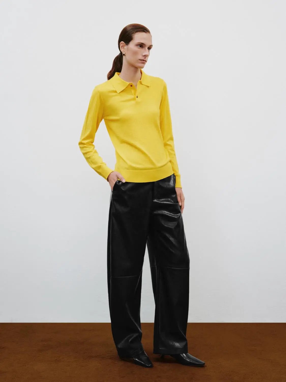 Polo Collar Long Sleeve Fitted Knit Sweater in yellow, paired with black leather-look pants.