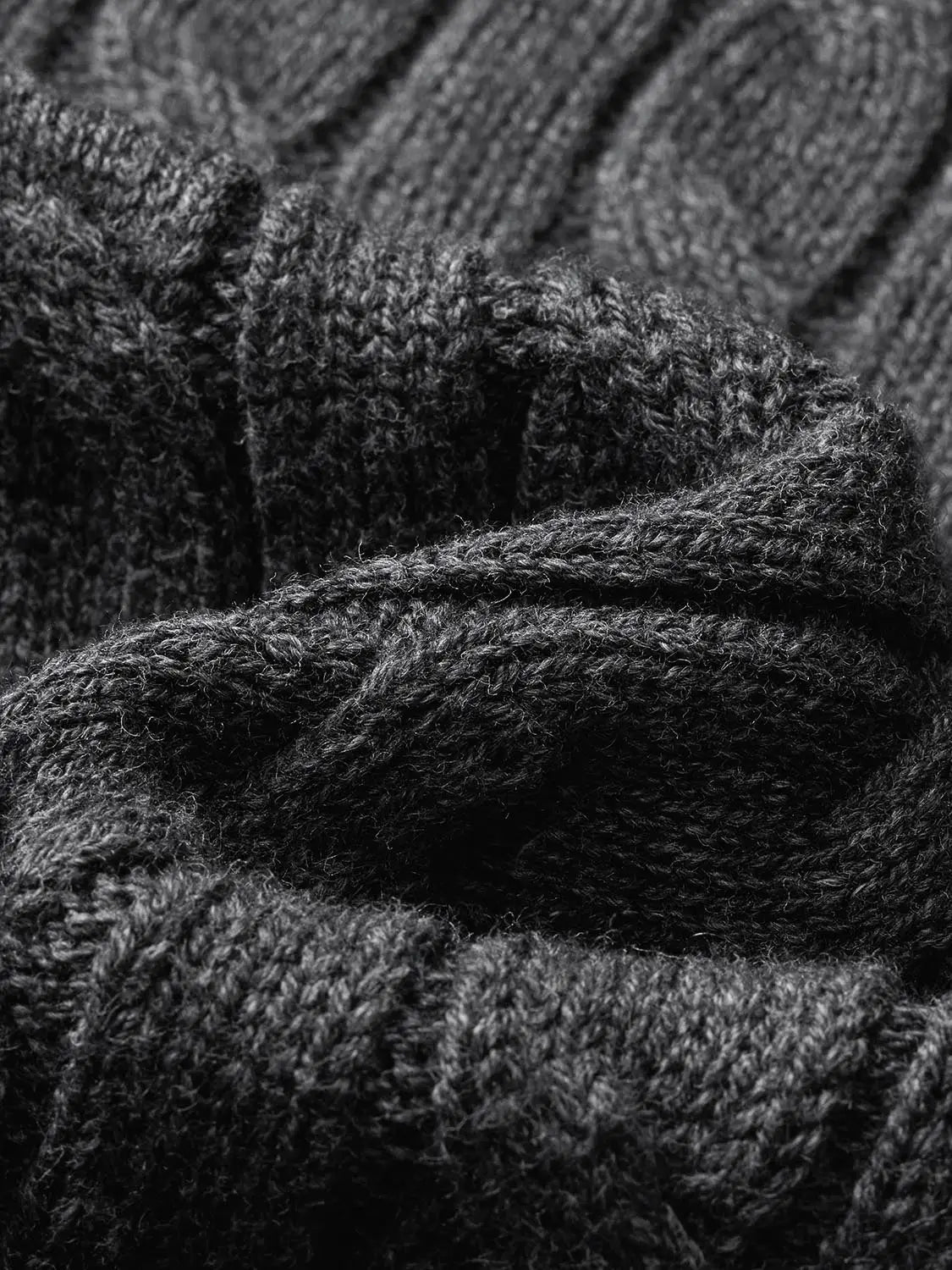 Knit jacket; close-up of dark charcoal knit fabric showing fuzzy texture.