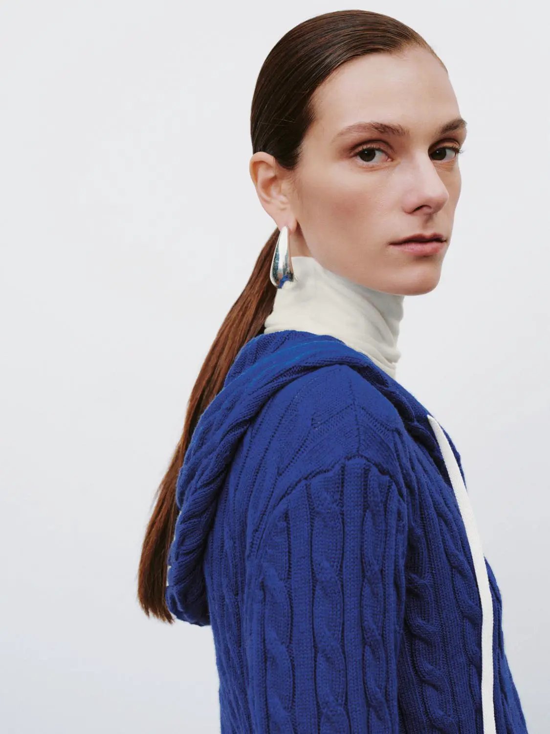 Cable-knit zip-front women's hoodie in blue; cotton-wool blend, long sleeves.