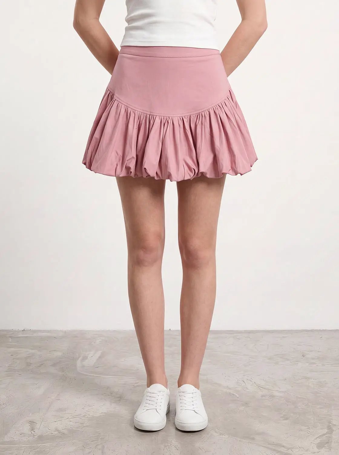 Cotton tiered ruffle skirt in pink with a wide waistband.