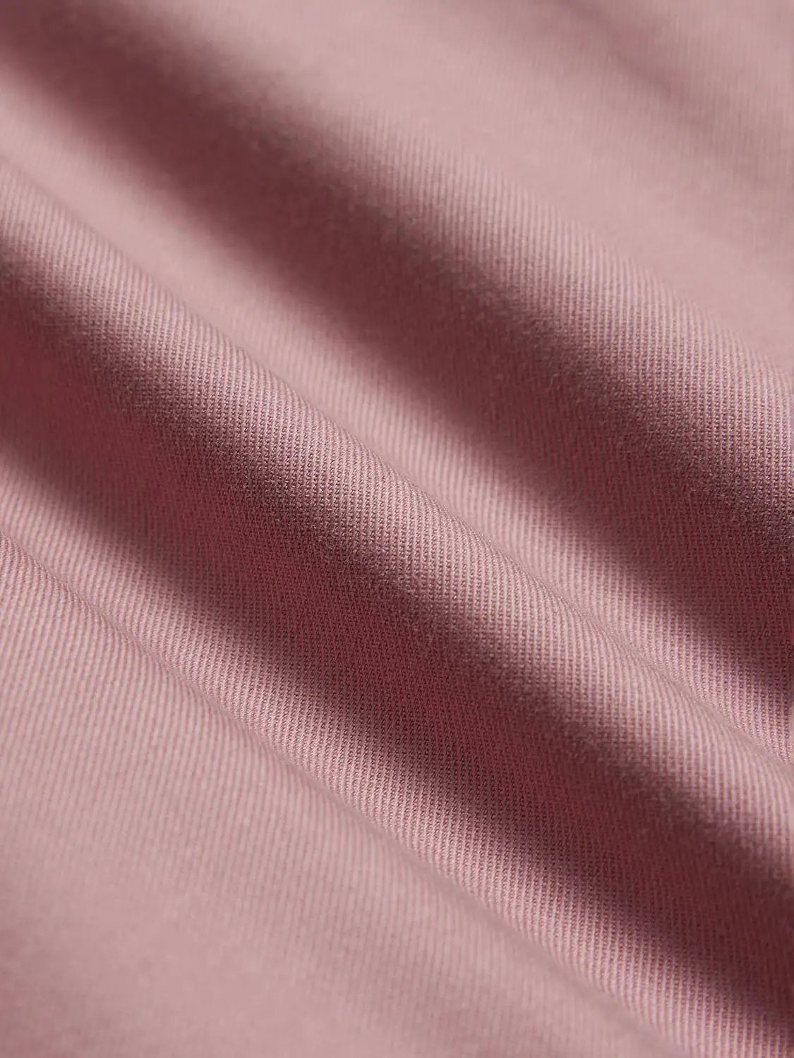 Pink cotton skirt fabric close-up with soft weave; Urban Revivo Fashion W_A-Line.