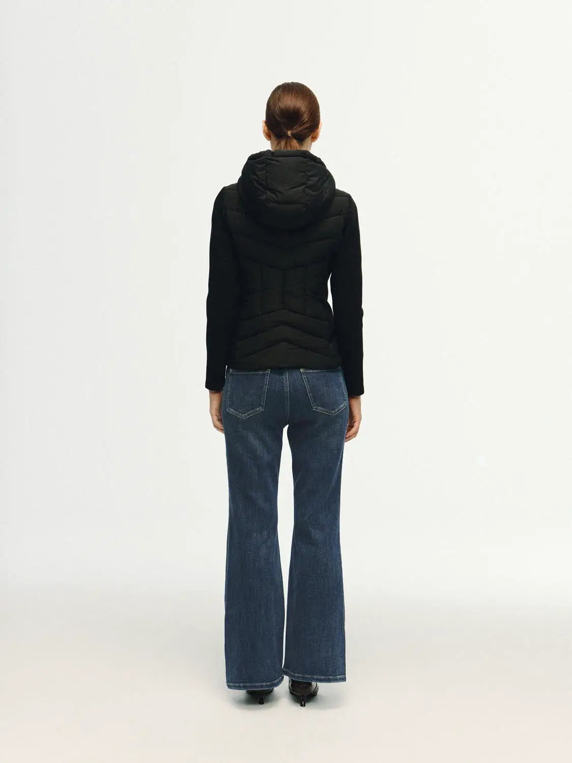 Padded jacket in black with hood, back view of model in jeans; Urban Revivo Fashion