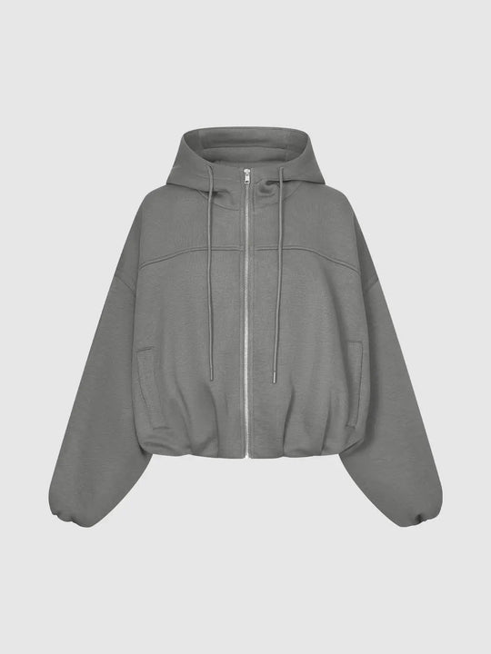 Giacca in misto cotone con cappuccio, spalle scese e chiusura integrale con cerniera