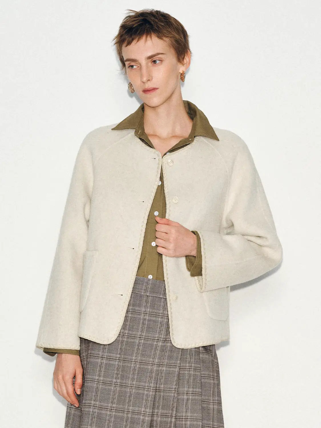 Coat in cream wool-blend with textured edges, styled over an olive shirt by Urban Revivo Fashion