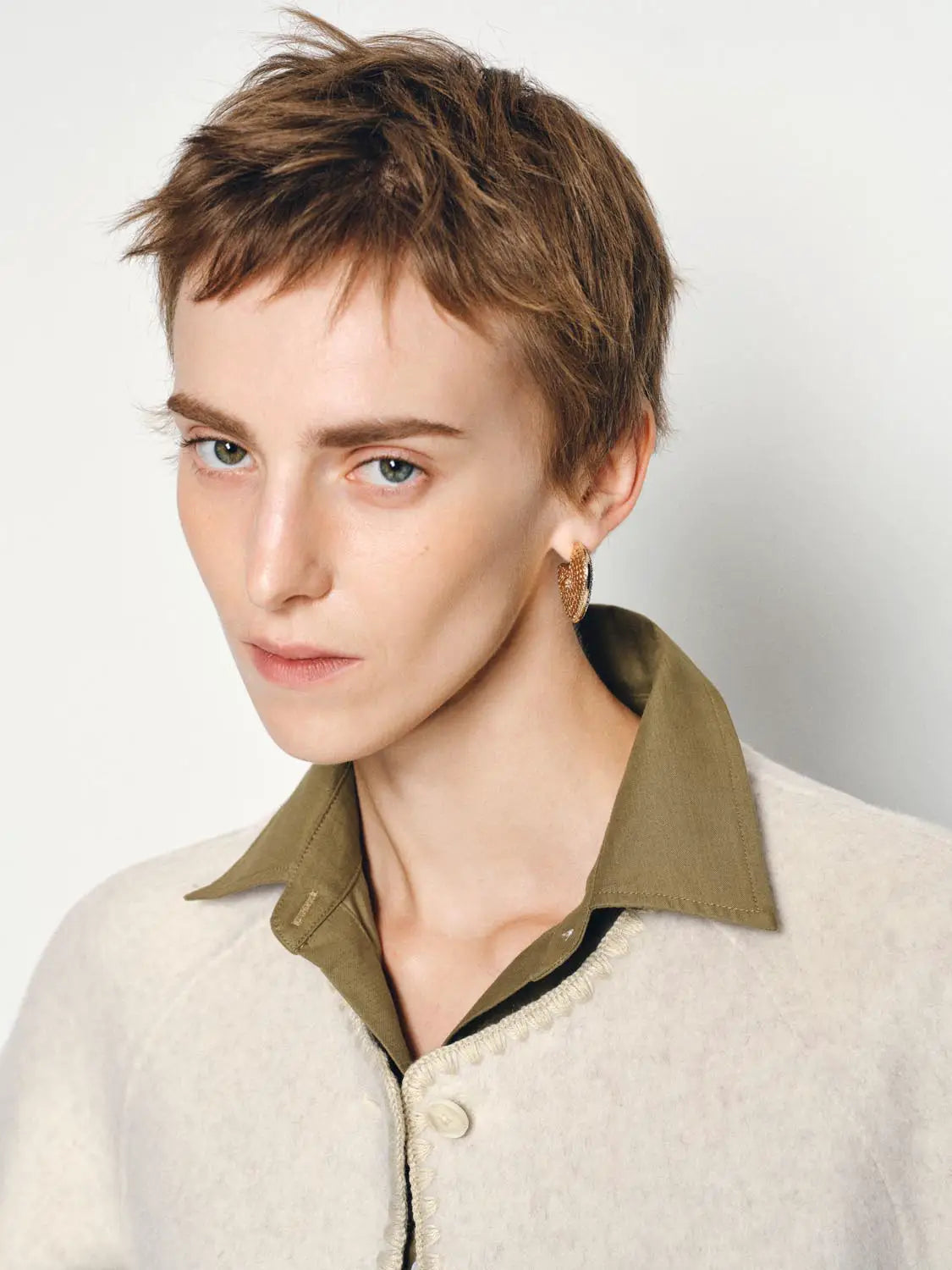 Coat by Urban Revivo Fashion; beige knit with olive-green collar and fringe trim.