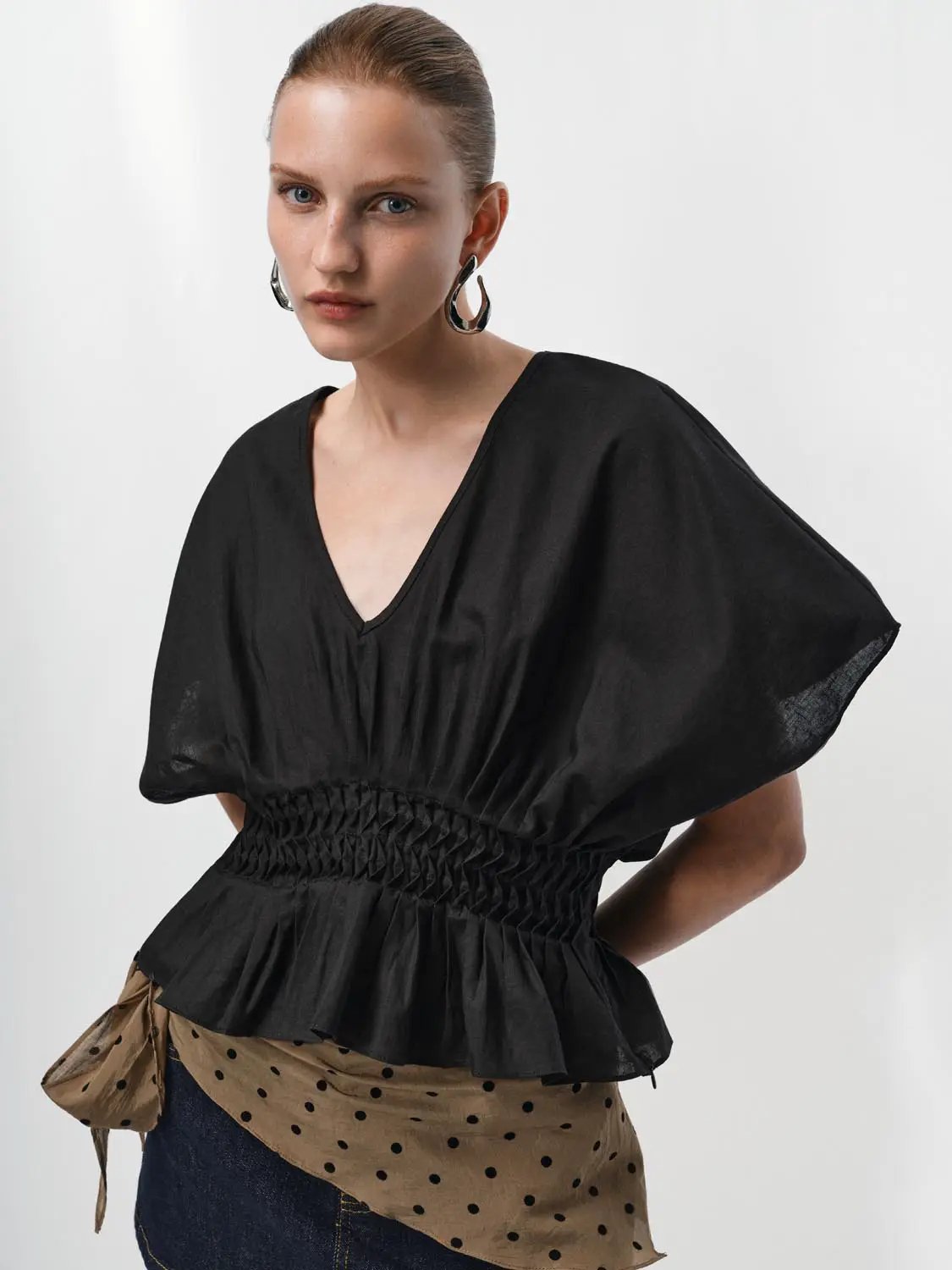V-neck puff-sleeve smocked-waist black cotton-linen blend blouse