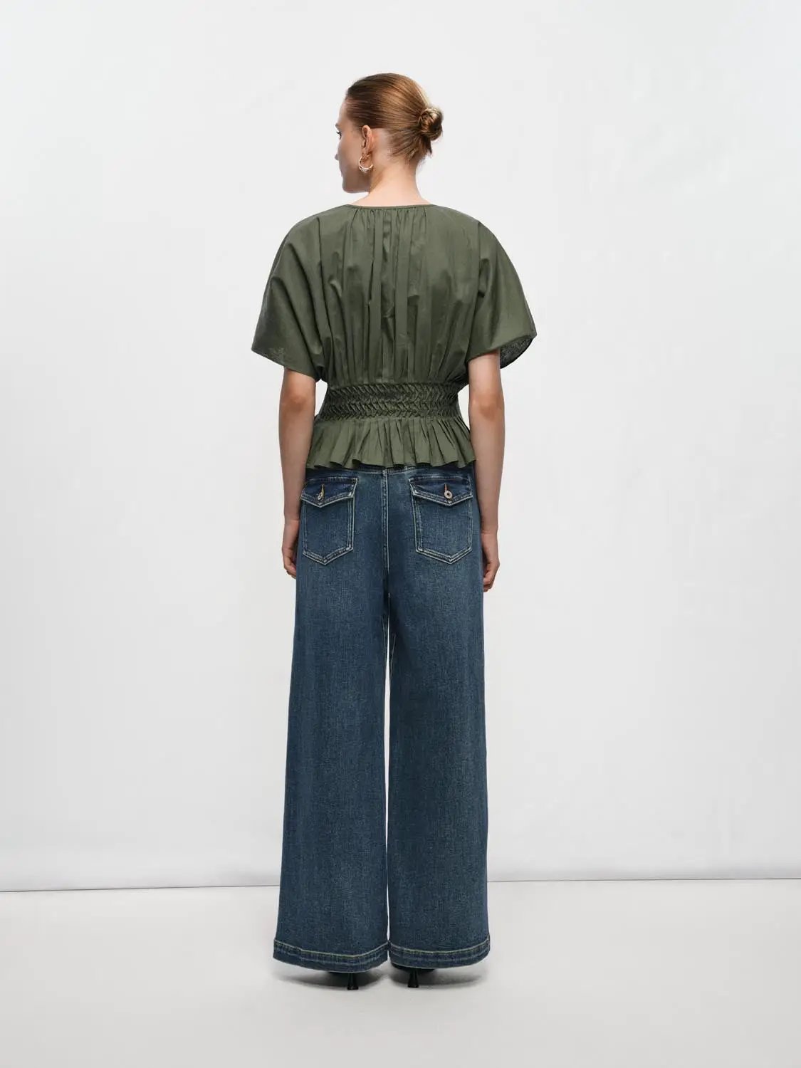 V-neck puff-sleeve blouse with smocked waist in olive green cotton-linen blend