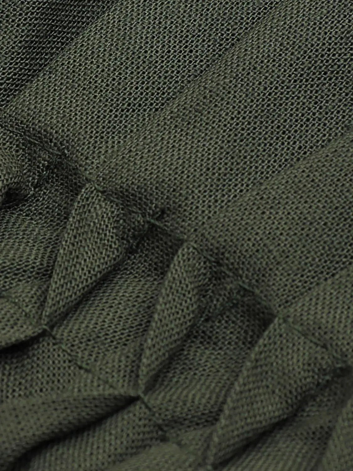 Olive green V-neck puff-sleeve blouse, textured cotton-linen blend with smocked waist.