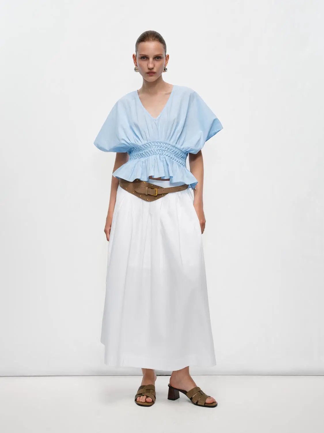 V-neck puff-sleeve smocked-waist cotton-linen blouse in light blue