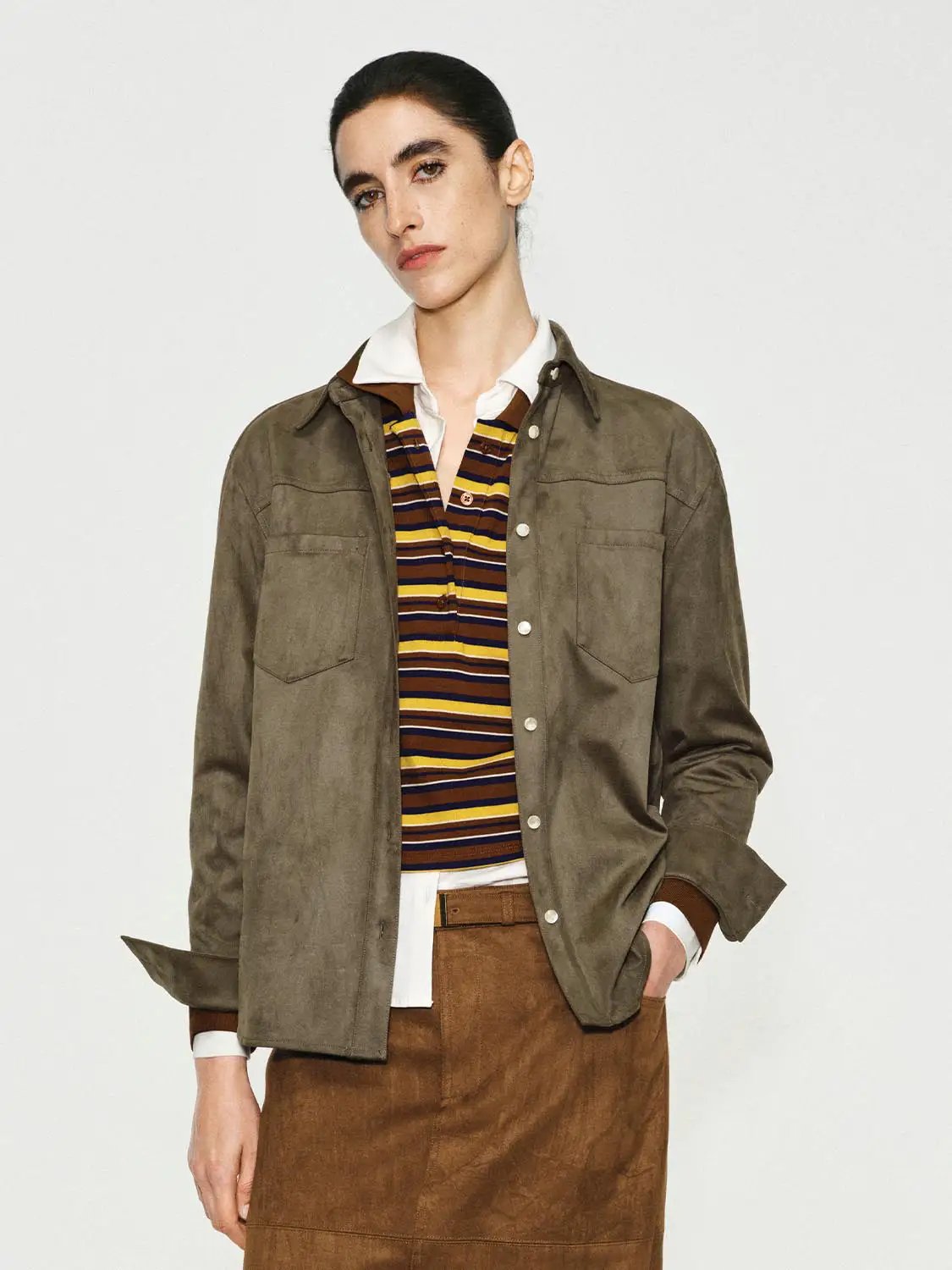 Button-down shirt in olive suede-like fabric with chest pockets.