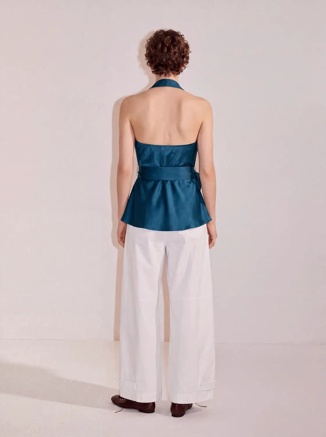 Blouse in teal satin with halter neckline and peplum waist, back view, Urban Revivo Fashion