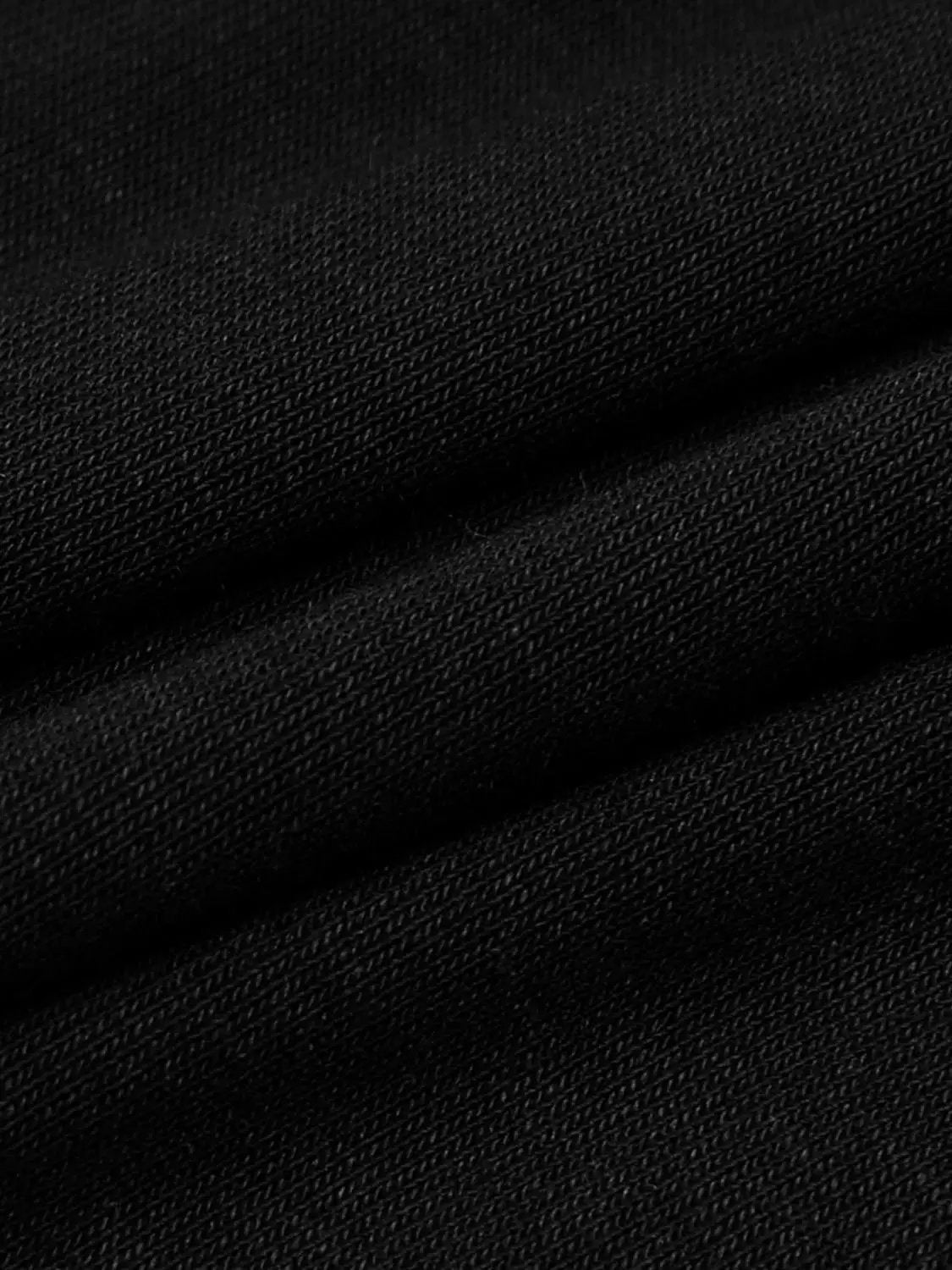 Draped Short Sleeve Ruched Waist T-shirt in black fabric close-up