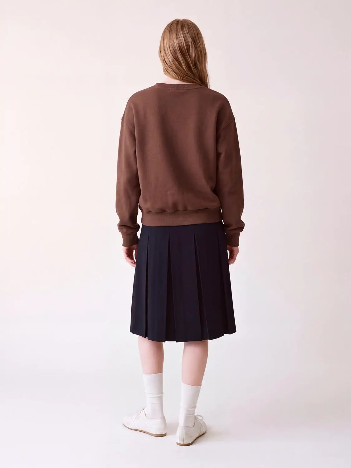 Sweatshirt back view in brown; relaxed fit with ribbed cuffs and hem.