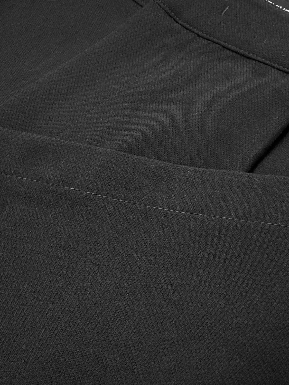 Wide-leg pants in black fabric with stitched seams