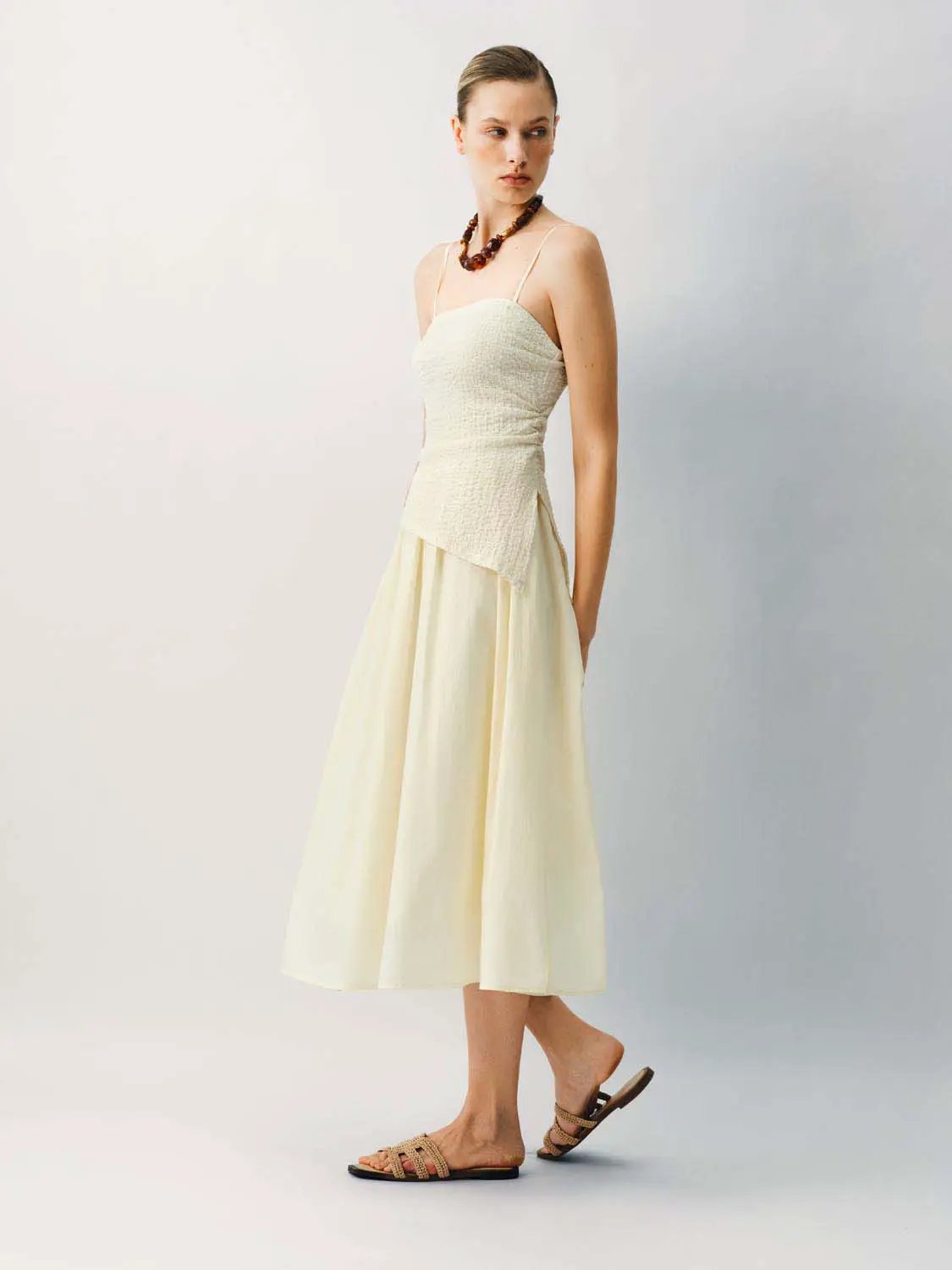 Thin stretch fabric strappy A-line midi dress in cream with a textured bodice