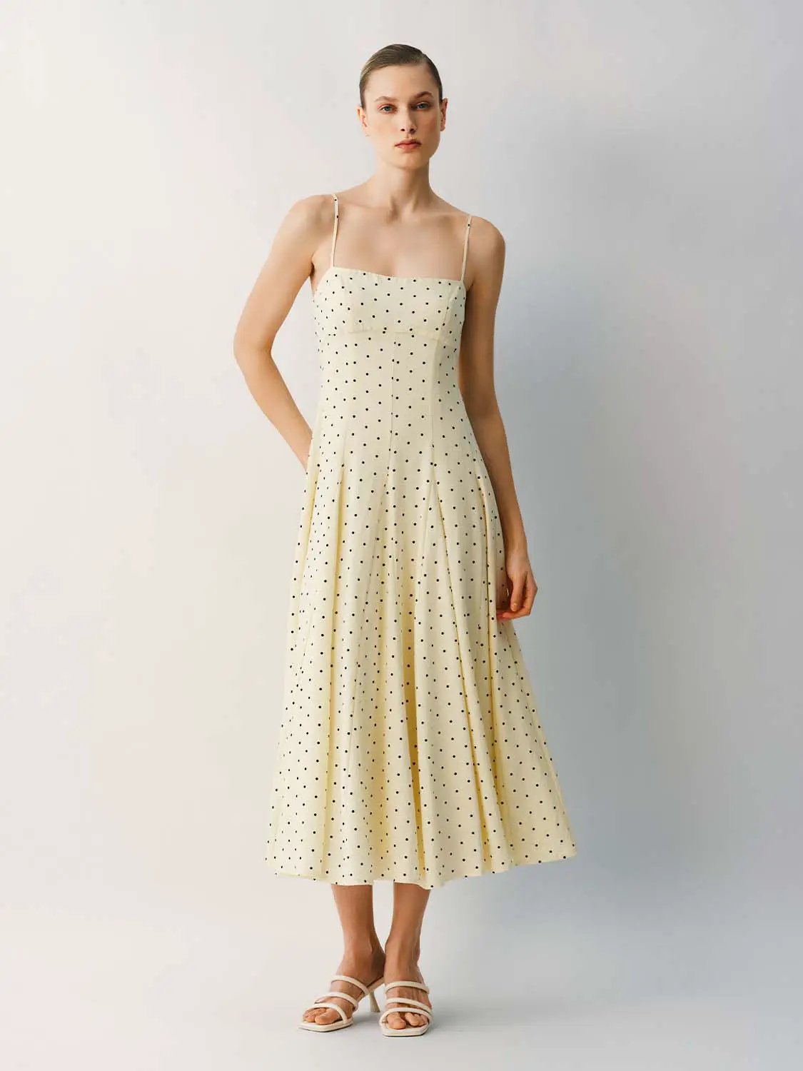 Polka Dot A-Line Dress in cream with black dots; spaghetti straps.
