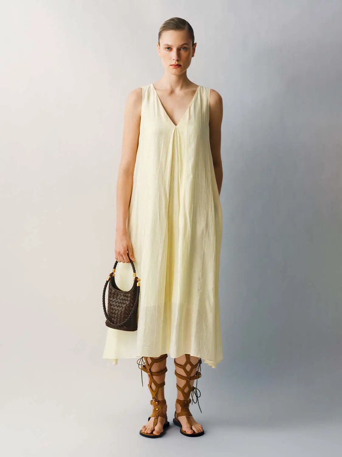 Slight Stretch A-Line Dress by Urban Revivo in pale yellow lightweight fabric, midi length.