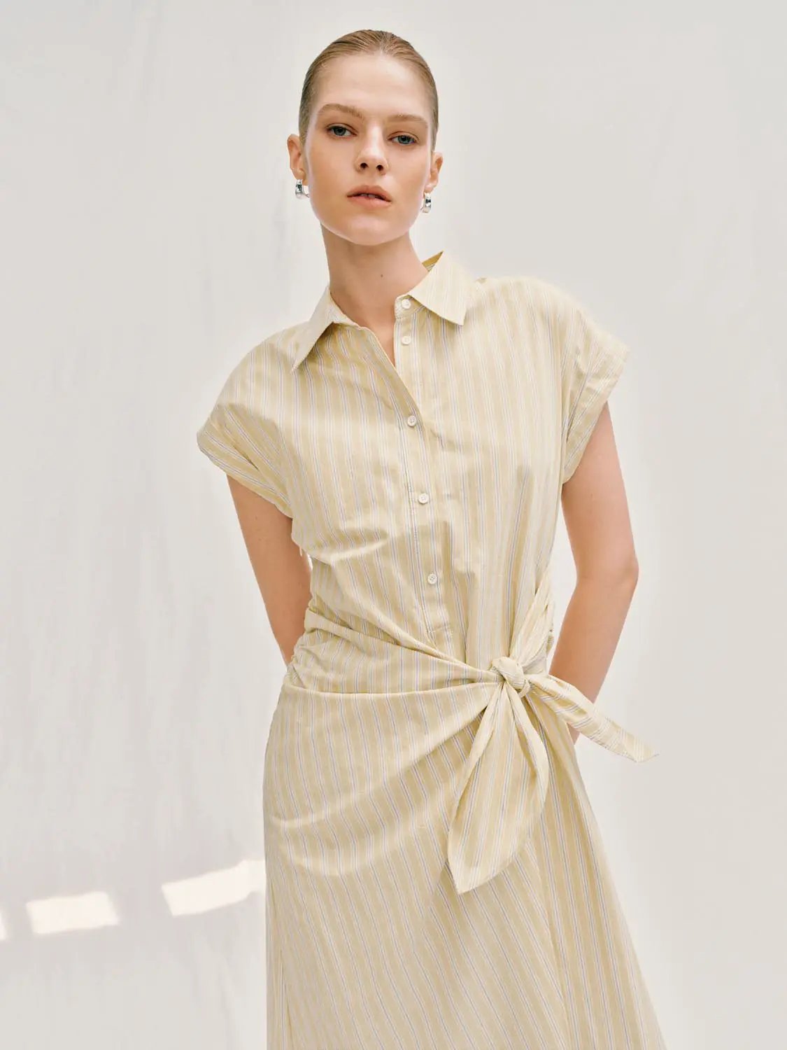 A-Line Dress in pale yellow striped fabric with waist tie.