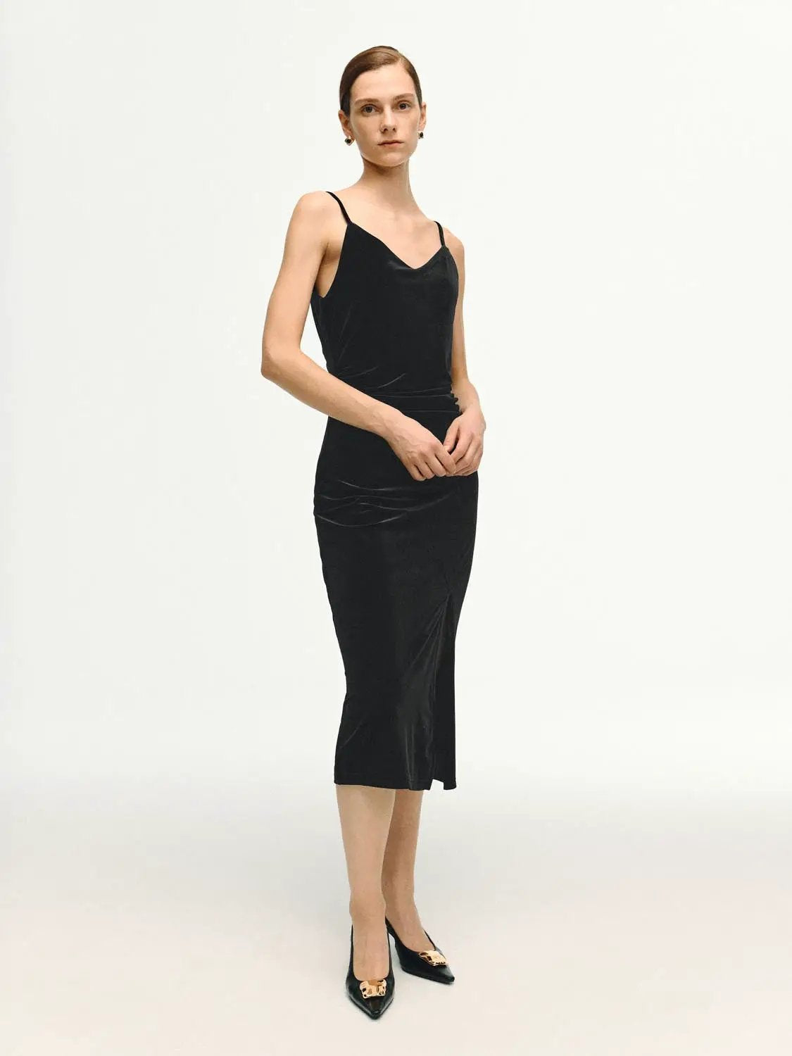 Sleek Spaghetti-Strap Midi Slit Dress in black velvet with side slit.