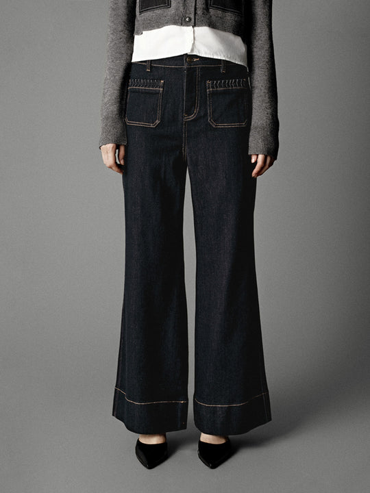 Jeans a zampa con tasche applicate