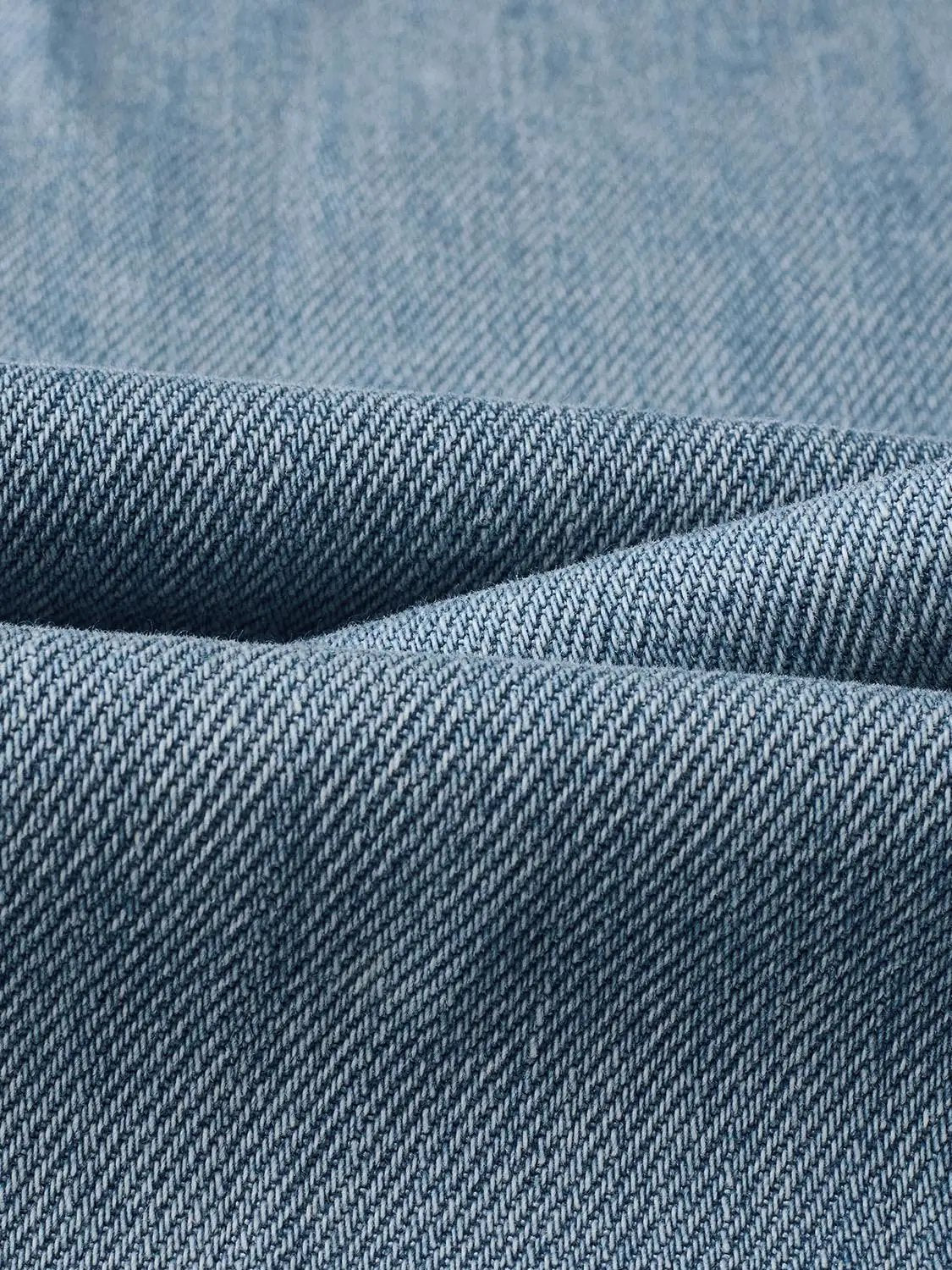 Urban Revivo Fashion jeans blue denim fabric close-up showing twill weave